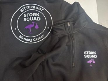 Black jackets with Stork Squad logo and text.