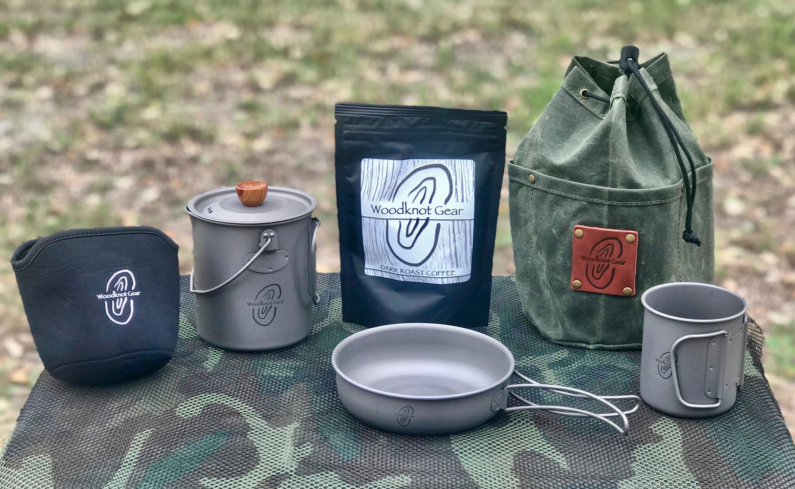 750ml coffee press with insulation coozie, coffee, wax canvas bag, fry pan and 300ml companion cup.