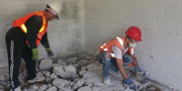 ABBA Construction Group workers removing concrete