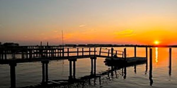 sunset view of the pier in stone harbor nj. 