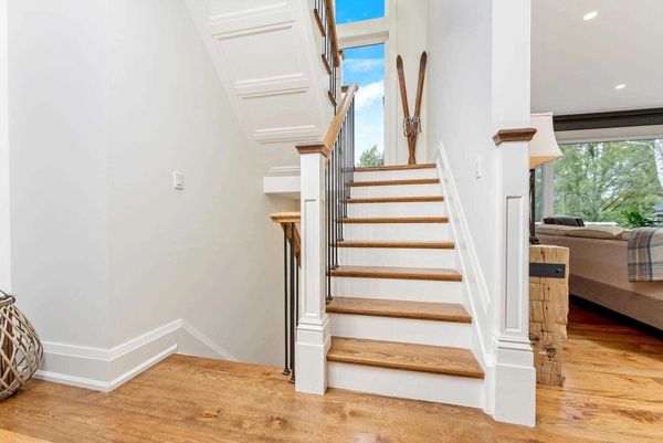 millwork restoration of craftsman stairs with oak treads, white risers, iron balusters in linwood nj