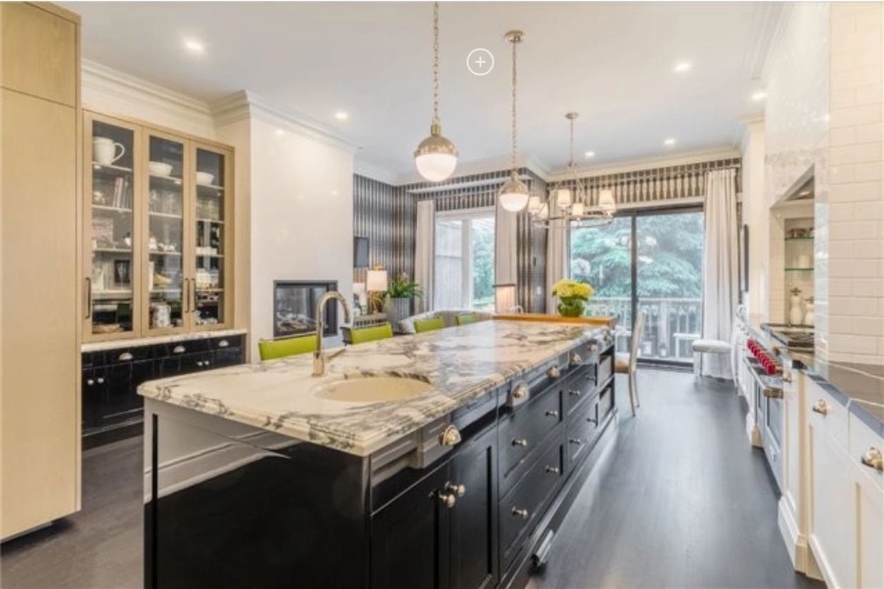 Black island with marble top, undercount sink with brushed nickel faucet.   Stone Harbor NJ ABBA 