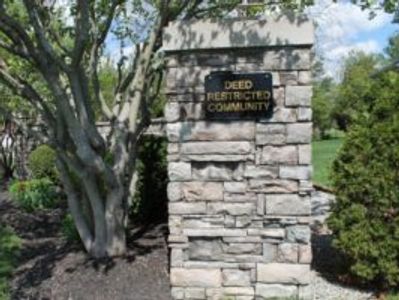 Deed Restricted Community sign at neighborhood entrance