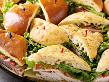 Assortment of sandwiches with a variety of meats, cheeses, tuna  egg salad, or veggie