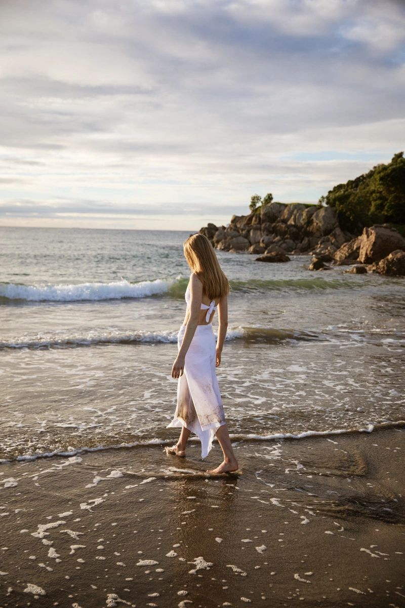 Woman walking on beautiful beach