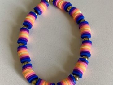 Colorful beaded bracelet with pink, orange, and blue beads.