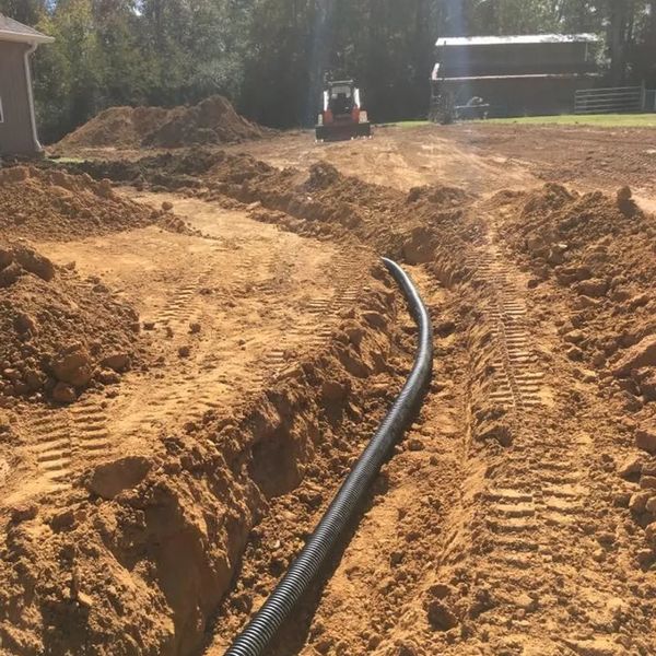 Installing drainage system on new custom home site