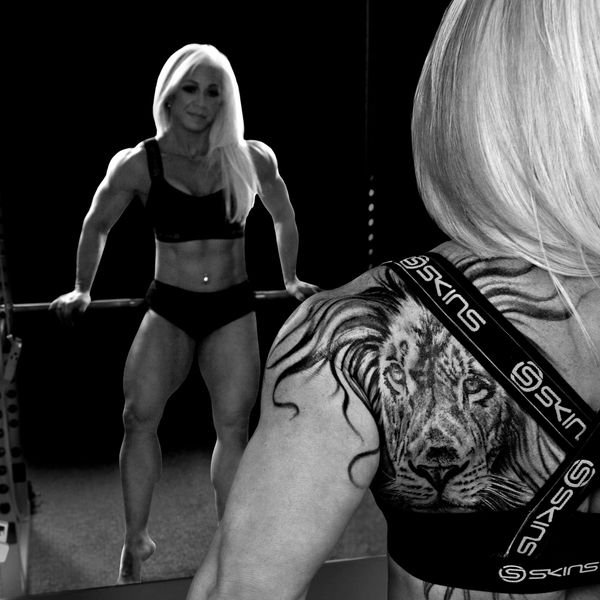 FITNESS MODEL LION TATTOO