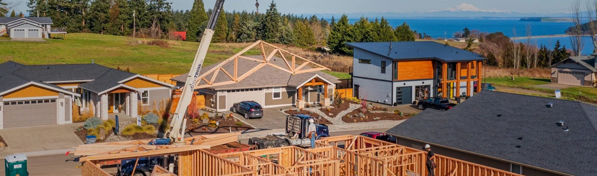 A construction worker waiting for trusses