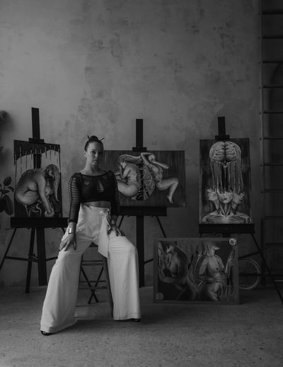 ZsOKA with her steel paintings in background