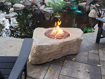 Sit back and relax next to your water feature with a Faux Rock Fire Feature