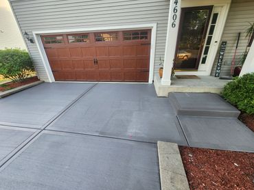 Colored concrete driveway and step.  Black Concrete driveway in Plainfield  IL.