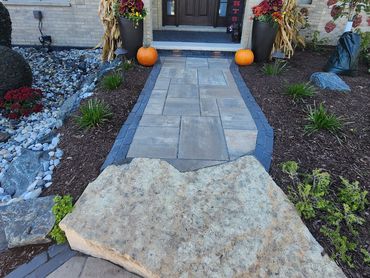 entryway paver walkway with cut in stepping stone and cut in in-lite lighting along with paver layov