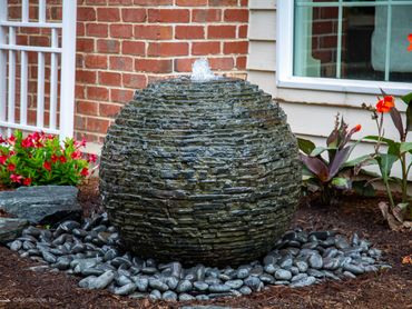 Add a water feature to that small space next to your patio to sit back and relax to.  