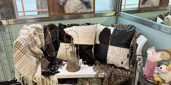 beautiful bench with throws and pillows in a western style