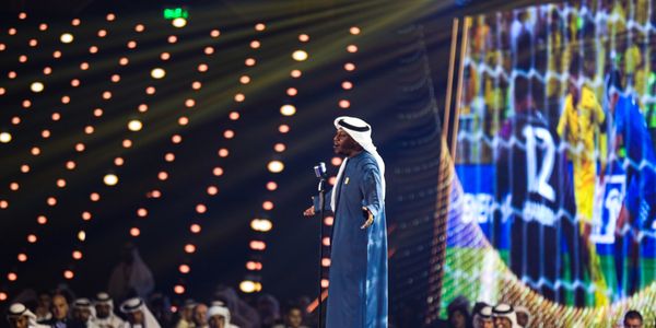 Arqam singing at the UAE pro-league award ceremony.
