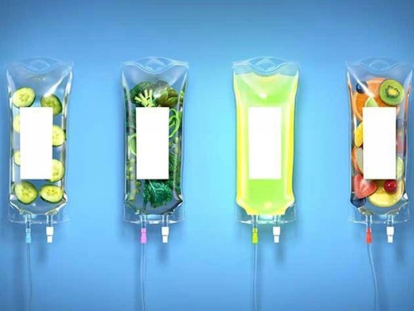 A group of IV bags filled with fruits and vegetables. 