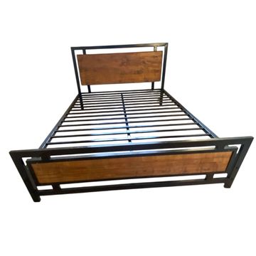 Metal and wood bed frame with slatted base and headboard.