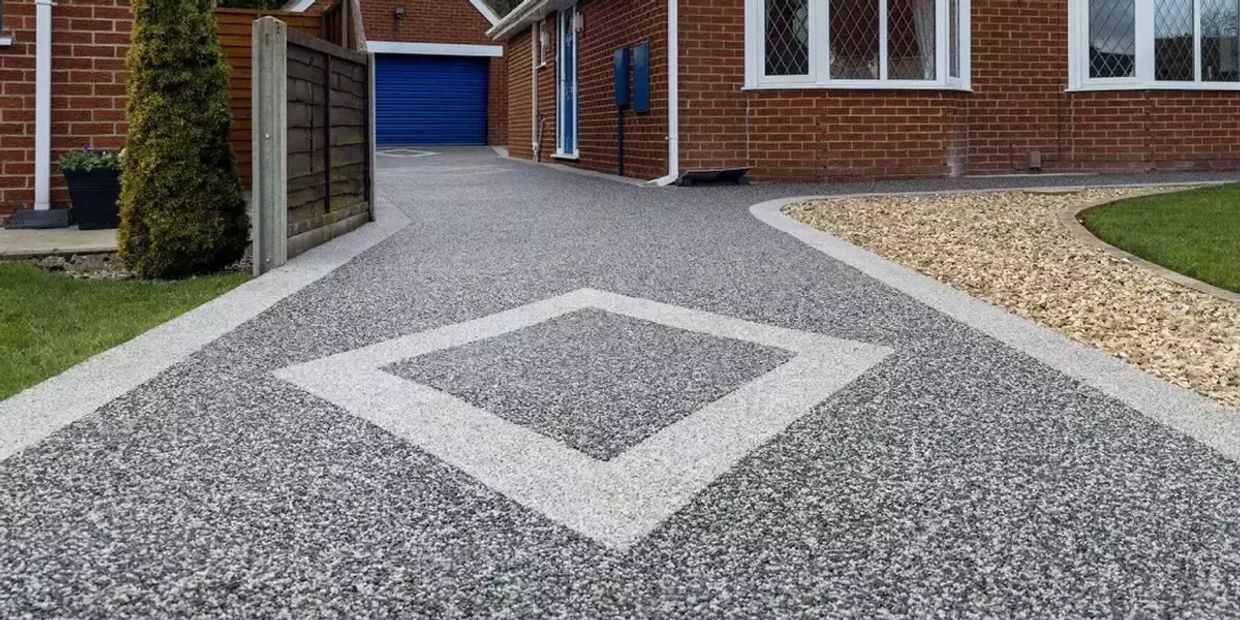 Resin driveway services Exeter tarmac surfacing concrete paving cobblestone driveway installation

