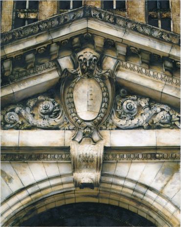 Close-up of an ornate building facade with intricate stone carvings.