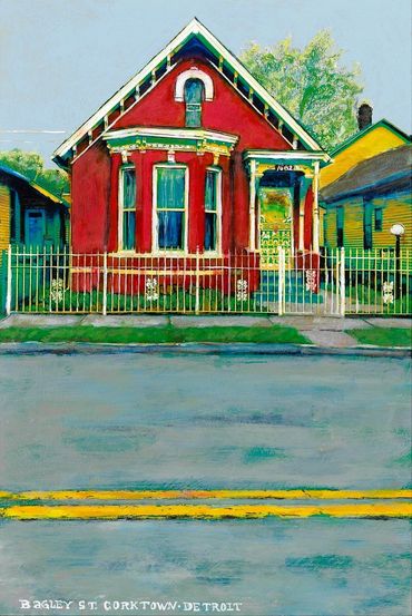 Bright red house with white trim and a white fence on a quiet street.