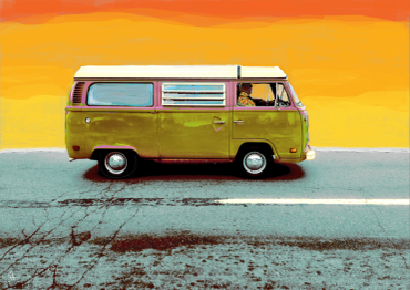 Vintage green camper van on a road at sunset.