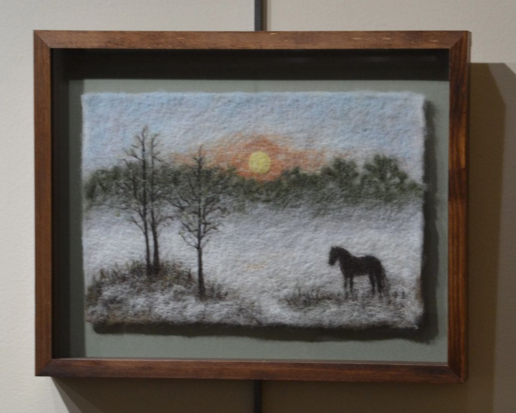 Framed felt artwork of a horse and trees at sunset.