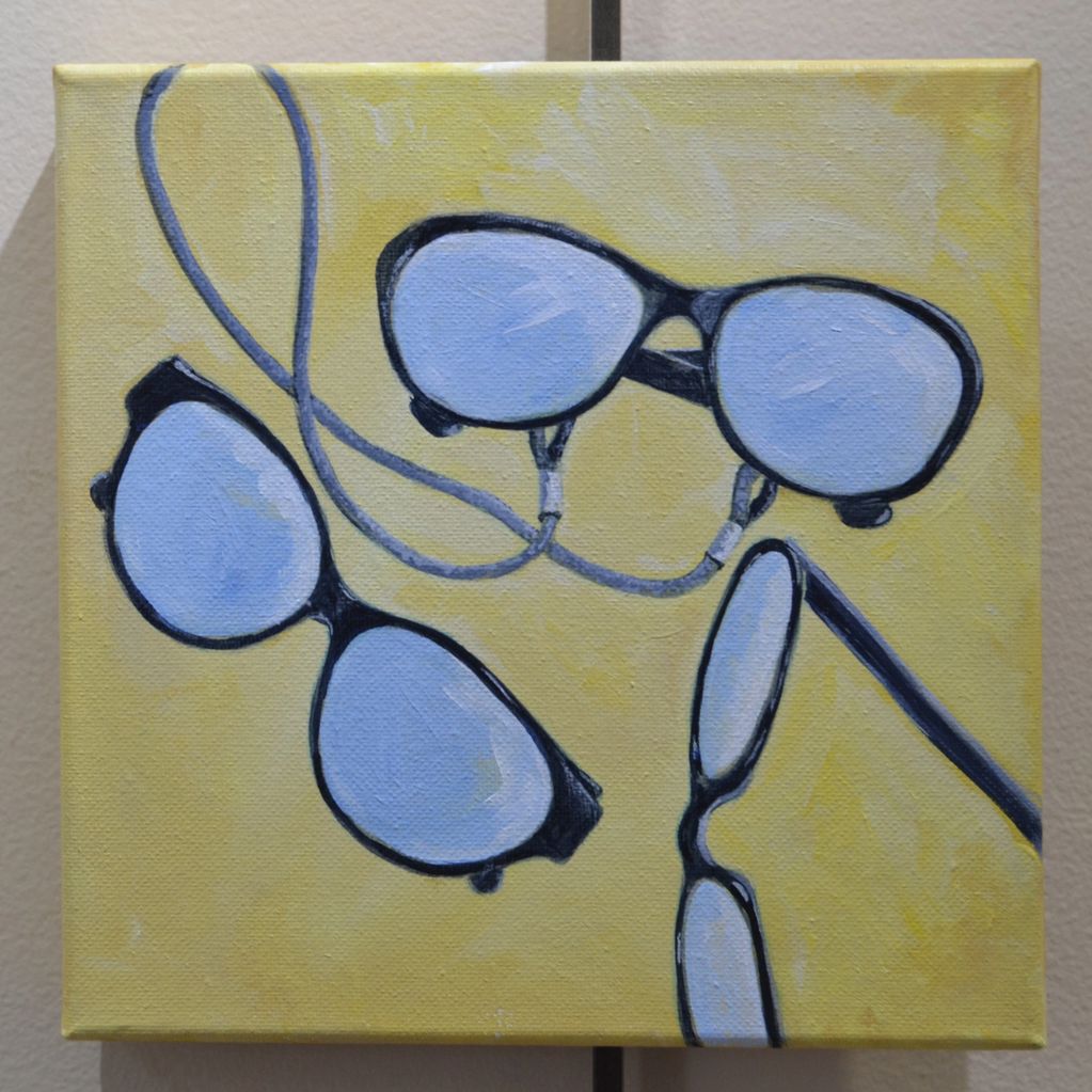 Painting of three pairs of glasses on a yellow background.
