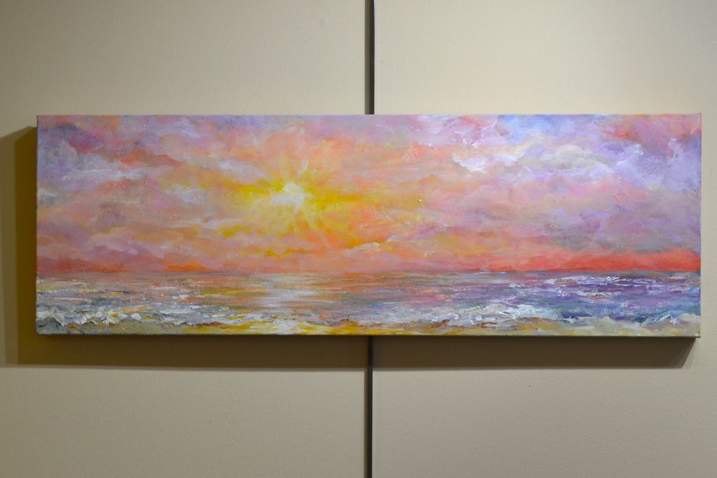 Sunset seascape painting with vibrant colors.