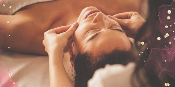 Woman receiving a relaxing facial massage.