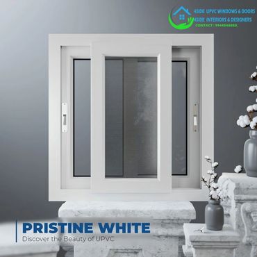 Elegant white uPVC sliding window displayed with decorative elements, highlighting its pristine, modern design.