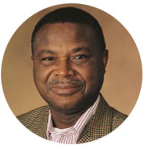 Portrait of a man smiling gently.