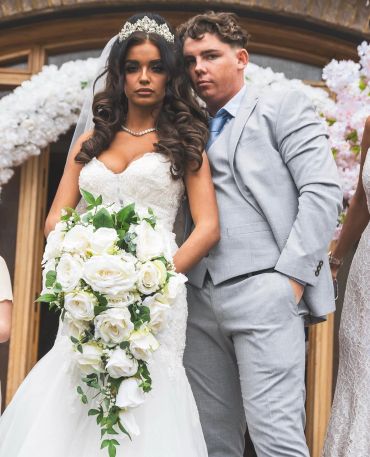 Bride and groom posing on their wedding day.