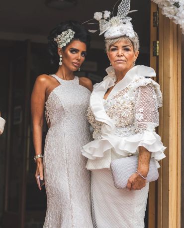 Two women dressed elegantly for a formal event.