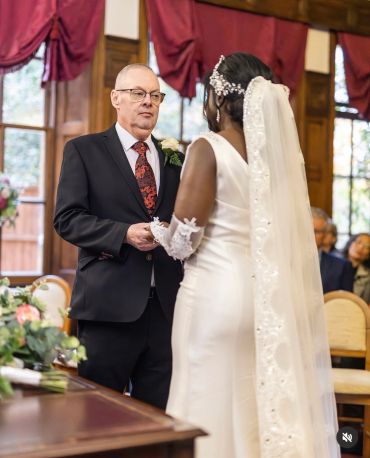 A couple exchanging vows at their wedding ceremony.