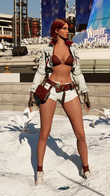 A woman in winter-themed attire stands confidently in a snowy festival setting.