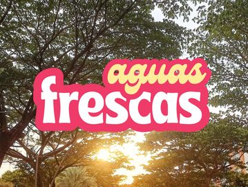 Sunlight shines through trees with 'aguas frescas' text overlay.