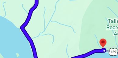 Map showing a blue route line ending at a red location marker.