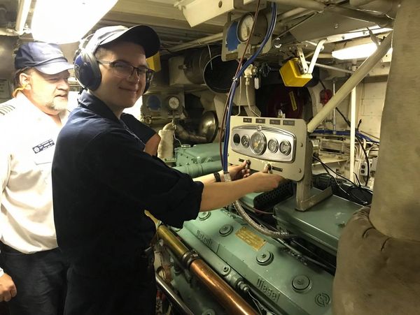 Cadets is practicing his skills in ship's engine room