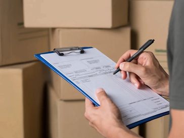 man with facture near boxes