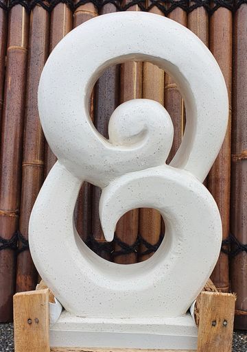 Abstract white sculpture with spiral design.