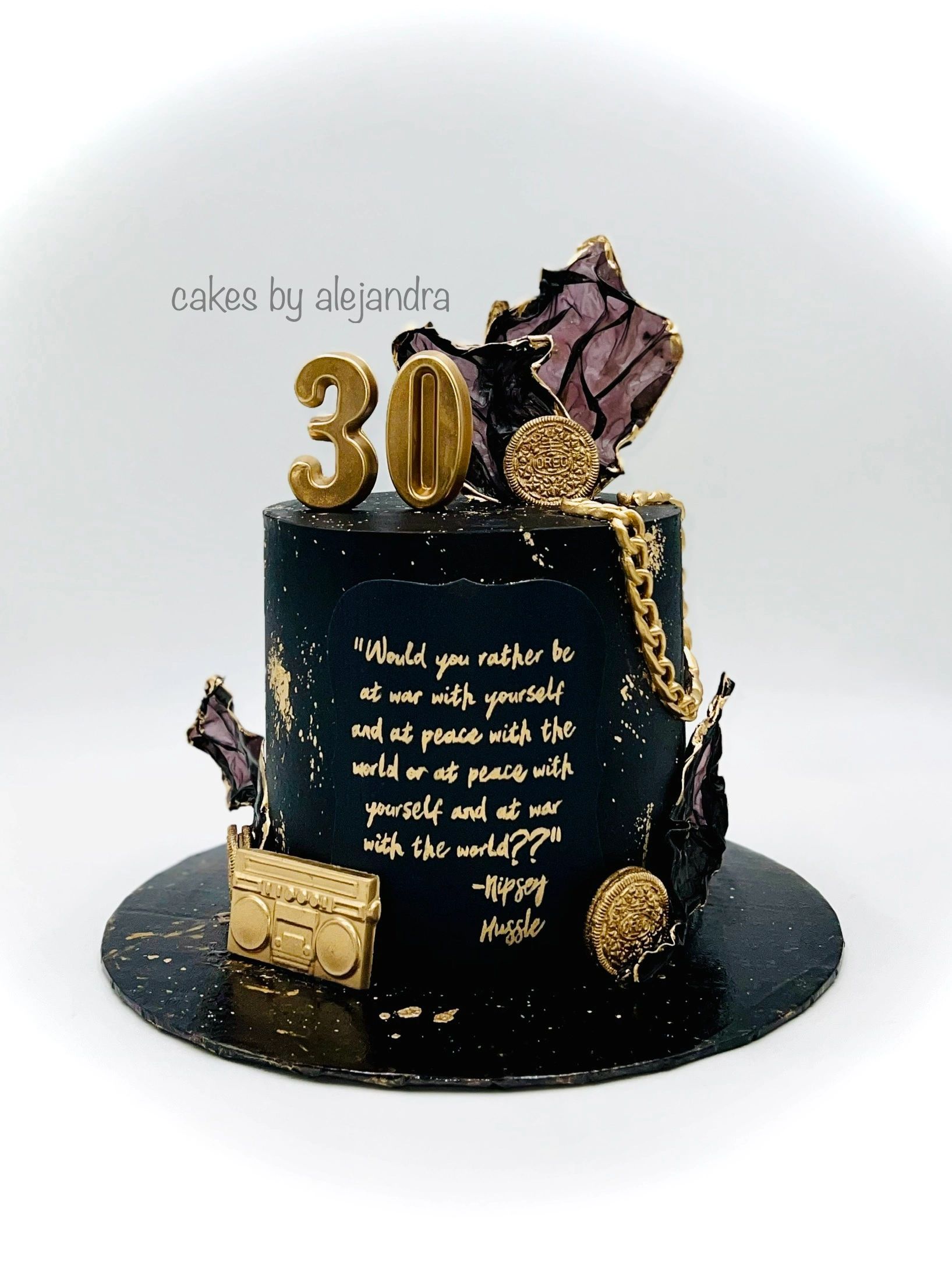 Elegant black and gold 30th birthday cake with a hip-hop theme and inspirational quote.