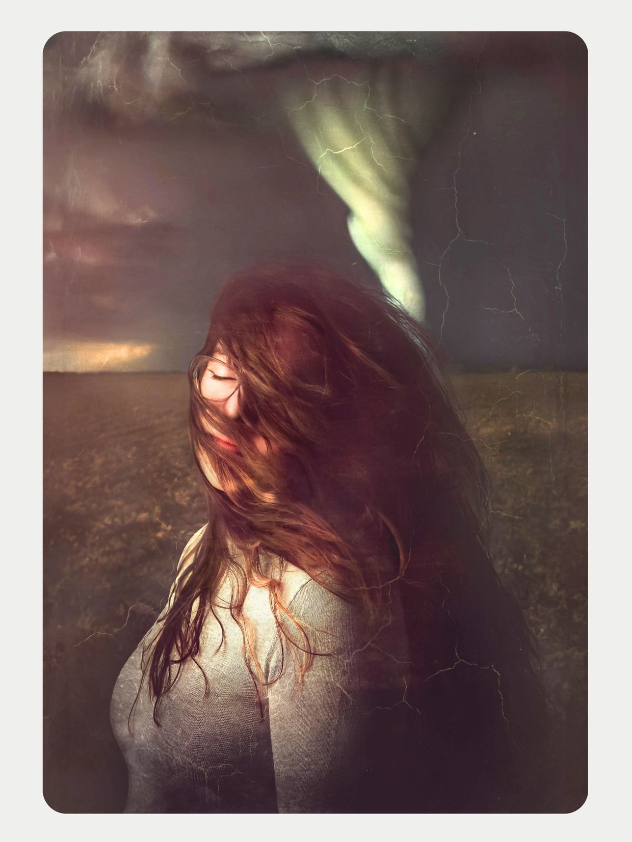 Woman facing the wind, eyes closed; textured, cinematic portrait with a tornado in the background