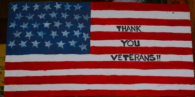 American flag with 'Thank You Veterans!!' message.