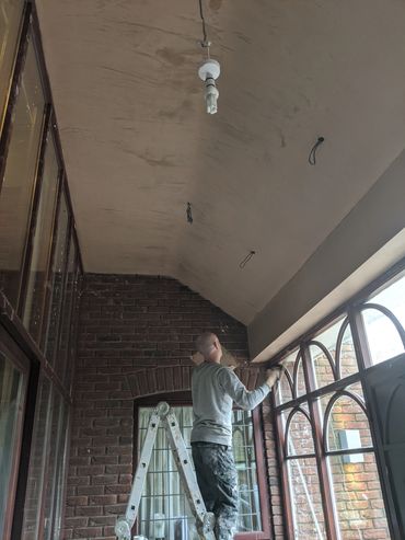 Hall Brothers Plastering Birmingham. curved ceiling being plastered by professional plasterer