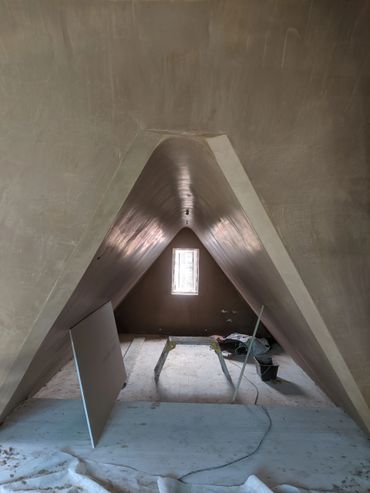 plastered arched attic ceiling with polished finish
