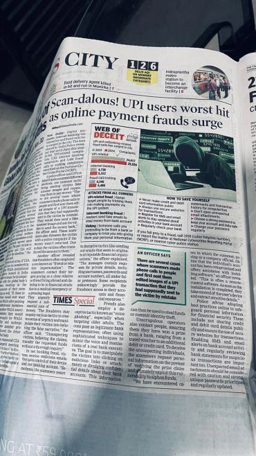 Newspaper article on UPI fraud surge and cyber threats.