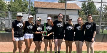 eight softball women holding trophy