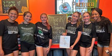 six softball girls at Fuzzy's restaurant 