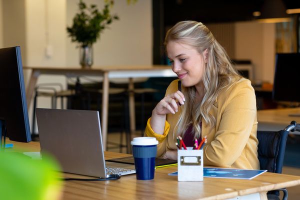 Young woman on laptop.  Seeking therapy for women in their 20s and 30s